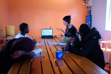 Volunteers teaching at Agatha Amani House
