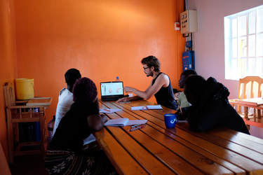 Volunteers teaching survivors at Agatha Amani House