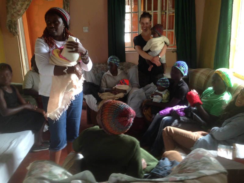 Our founder with some of the shelter's survivors and their babies.
